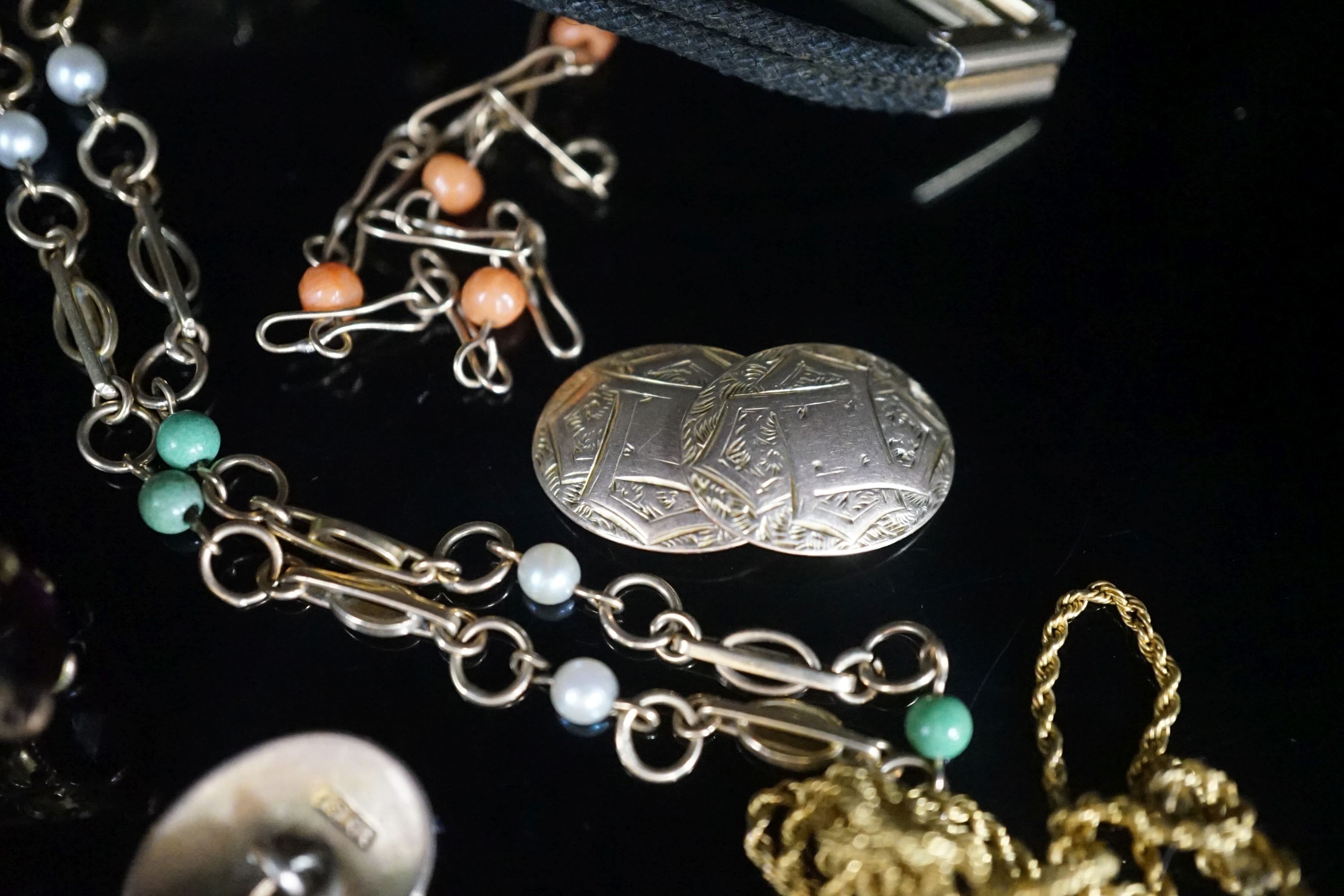 A group of mixed jewellery a pair of 10ct cufflinks, assorted fobs, a 9ct ropetwist chain(a.f.), a 9ct necklace, a 9ct gold small bracelet, wrist watch, locket etc.